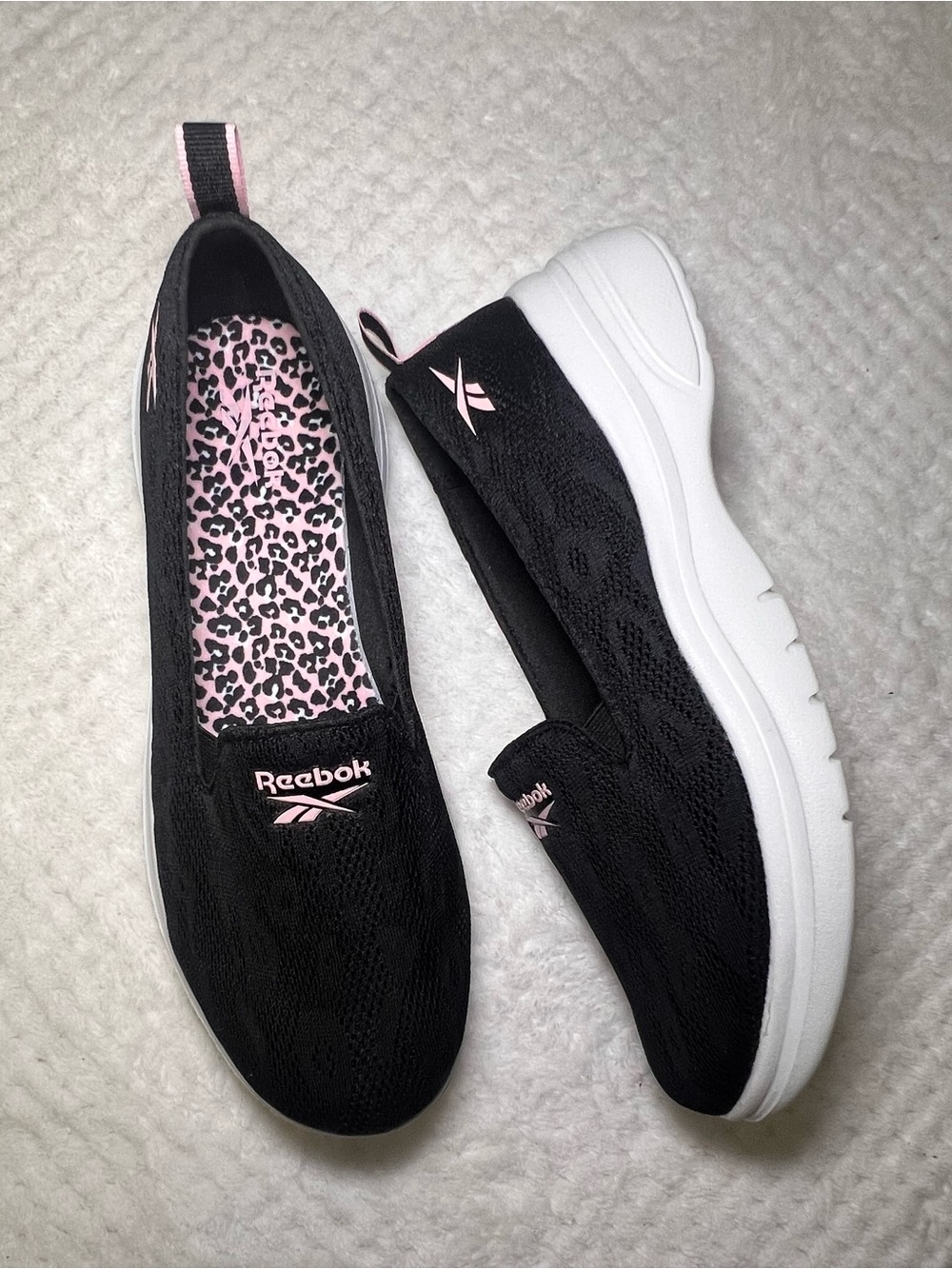 Reebok Women's Black Slip-On Athletic Shoes with Pink Accents